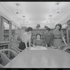 Staff members Miriam Gross, Genevieve Oswald, Leroy Fentress, and Jacqueline Maskey in the Dance Collection of the New York Public Library