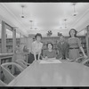 Staff members Miriam Gross, Genevieve Oswald, Leroy Fentress, and Jacqueline Maskey in the Dance Collection of the New York Public Library