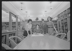 Staff members Miriam Gross, Genevieve Oswald, Leroy Fentress, and Jacqueline Maskey in the Dance Collection of the New York Public Library