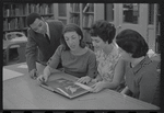 Staff members Miriam Gross, Genevieve Oswald, Leroy Fentress, and Jacqueline Maskey in the Dance Collection of the New York Public Library