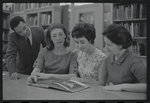 Staff members Miriam Gross, Genevieve Oswald, Leroy Fentress, and Jacqueline Maskey in the Dance Collection of the New York Public Library