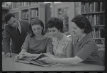 Staff members Miriam Gross, Genevieve Oswald, Leroy Fentress, and Jacqueline Maskey in the Dance Collection of the New York Public Library