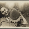 Photograph of Genevieve Taggard with a sunflower inflorescence