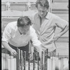 Ming Cho Lee and Joseph Papp conferring before set model for the stage production Troilus and Cressida during rehearsal at the Delacorte Theater