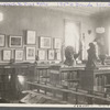View of sculptures and prints in reading room at 135th Street Branch Library