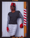 Model Kym Clark wearing Patrick Kelly Paris outfit, including dotted and striped long-sleeve dress, gloves, and fez
