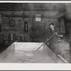 Making cheese in rural cheese factory. Oswego County, New York