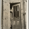 Fred Ess in the door of his farmhouse. Dalton, New York, Allegany County