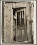 Fred Ess in the door of his farmhouse. Dalton, New York, Allegany County