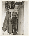 Clothes and lanterns in the farm home of Fred Ess. Near Dalton, New York