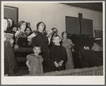 Choir singing at revival meeting in Pentecostal church. Cambria, Illinois