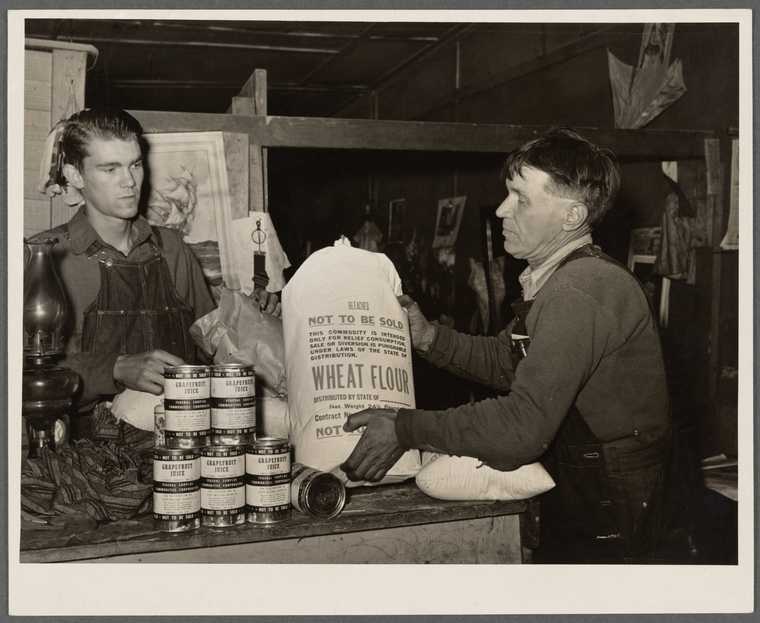Unemployed miner with food from surplus commodities corporation ...