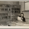 Homesteader in the library. Jersey Homesteads, Hightstown, New Jersey