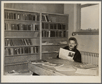 Homesteader in the library. Jersey Homesteads, Hightstown, New Jersey