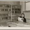 Homesteader in the library. Jersey Homesteads, Hightstown, New Jersey