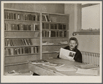 Homesteader in the library. Jersey Homesteads, Hightstown, New Jersey