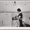 Mrs. Pingry in kitchen of her home. Decatur Homesteads, Indiana