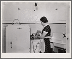 Mrs. Pingry in kitchen of her home. Decatur Homesteads, Indiana