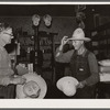Farmer buying a new hat in the store at Blankenship, Indiana