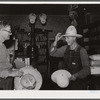 Farmer buying a new hat in the store at Blankenship, Indiana