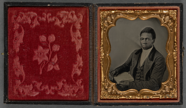 Digital representation of an ambrotype portrait of Black Man in a Dark Suit and Tie, Holding Book