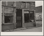 Abandoned store in which coal miner on relief lives. Zeigler, Illinois