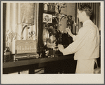 Bartender in Rainbow Room of Ly-Mar Hotel. Herrin, Illinois