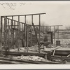 House being torn down for scrap lumber. Johnston City, Illinois