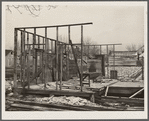 House being torn down for scrap lumber. Johnston City, Illinois