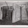 Safety inspector. This man uses a special lamp to test for gas throughout the mine. Old Ben number eight, West Frankfort, Illinois