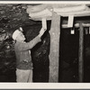 Safety engineer with rock dust traps to prevent spread of mine explosions. Old Ben number eight. West Frankfort, Illinois