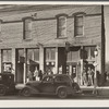 Unemployed miners on street corner. Johnston City, Illinois