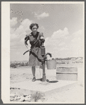 Farm girl pumping water. Fairfield Bench Farms, Montana, [Teton County,] Montana