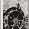 Farmer and tractor. Fairfield Bench Farms, [Teton County,] Montana