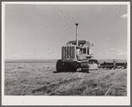 Tractor with noble blade on Sheffels' wheat farm. Cascade County, Montana
