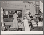 Cook and hired girl in kitchen. Quarter Circle 'U' Ranch, Montana