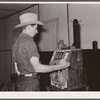 Dude playing a slot machine. Birney, Montana