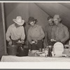 Cowhand at dinner. Quarter Circle 'U' ranch roundup. Big Horn County, Montana