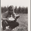 Bud Kimberley eating watermelon. Jasper County, Iowa