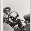 Bud Kimberley drives tractor. Jasper County, Iowa