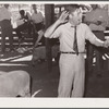 Auctioneer at 4-H Club lamb sale. Central Iowa Fair, Marshalltown, Iowa
