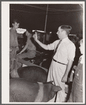 Auctioneer at hog sale. Central Iowa Fair, Marshalltown, Iowa