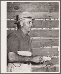 Luther Passmore, farmer, with hybrid corn. Polk County, Iowa