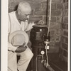 County agent with electric waterpump made possibly by Rural Electrification Adiministration. Grundy County, Iowa