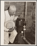 County agent with electric waterpump made possibly by Rural Electrification Adiministration. Grundy County, Iowa