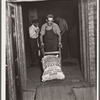 Loading freight car with potatoes. Monte Vista, Colorado