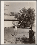 Pupils of one room school house playing ball during recess. Grundy County, Iowa