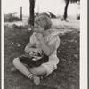 Schoolgirl, pupil of one-room schoolhouse, eating lunch. Grundy County, Iowa