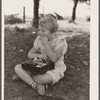 Schoolgirl, pupil of one-room schoolhouse, eating lunch. Grundy County, Iowa