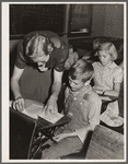 Lois Slinker and one of her pupils in one-room schoolhouse. Grundy County, Iowa